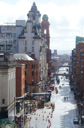 Buses, pedestrians and cyclists in Oxford Road, Manchester