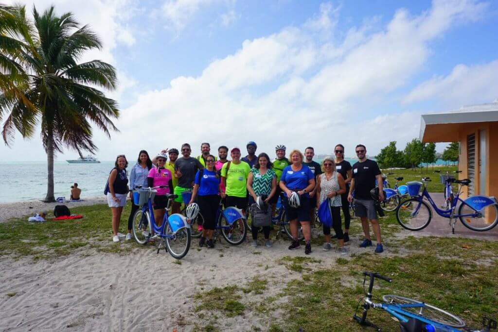 Participants at the beach with bikes after one of the field trips during the 2022 Safe Streets Summit